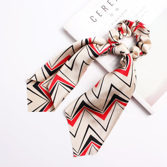 Élastique pour cheveux avec grand nœud en satin
